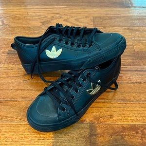 Black Adidas Nizza with gold logo